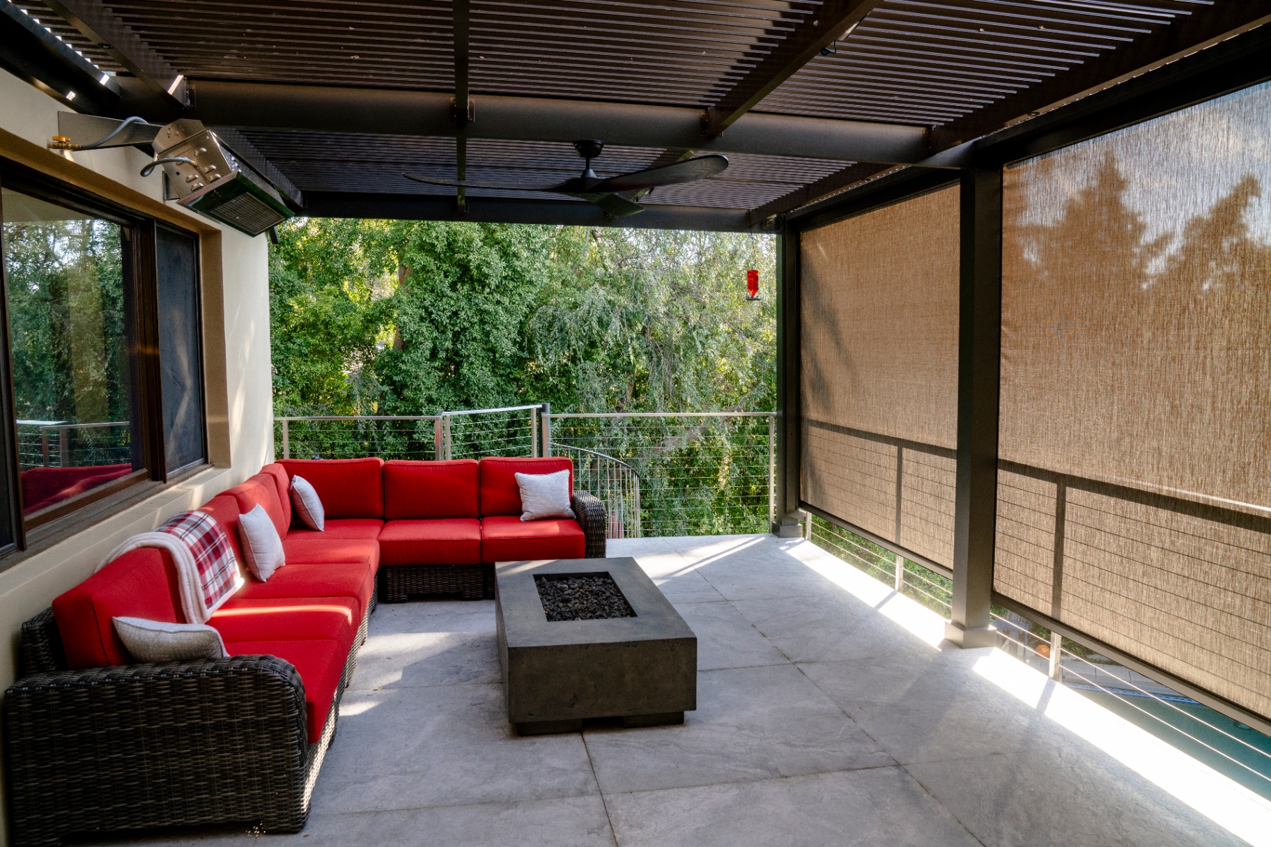 Mirage H4500 motorized retractable screen installed on a luxury outdoor patio